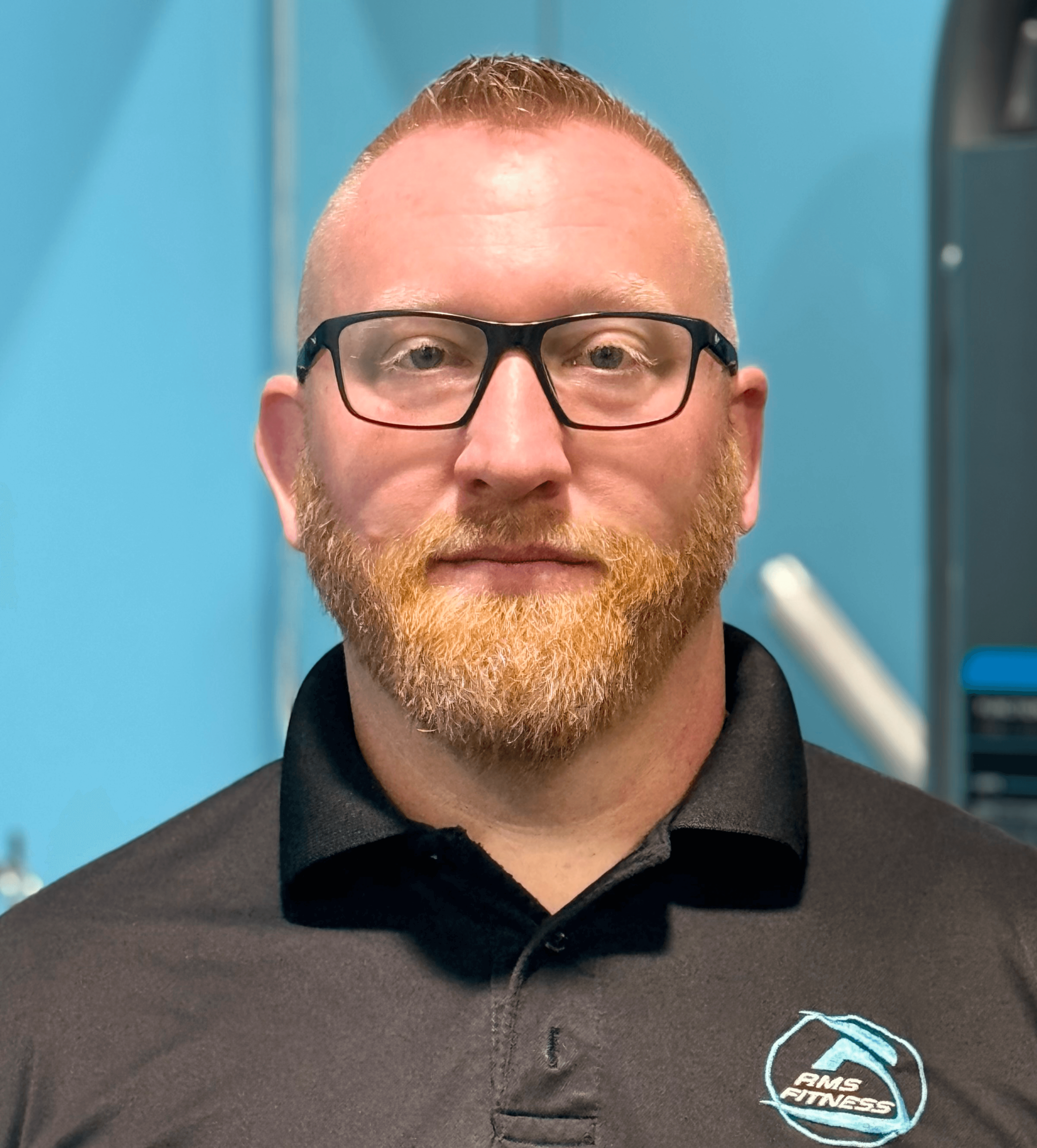 Portrait of Adam with a blue background