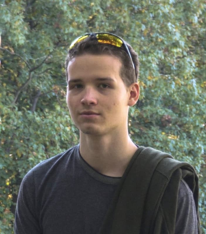 Devon smiling in a portrait