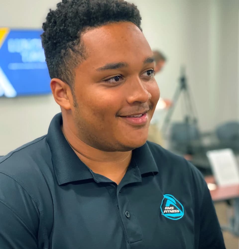 Gray smiling in his work uniform