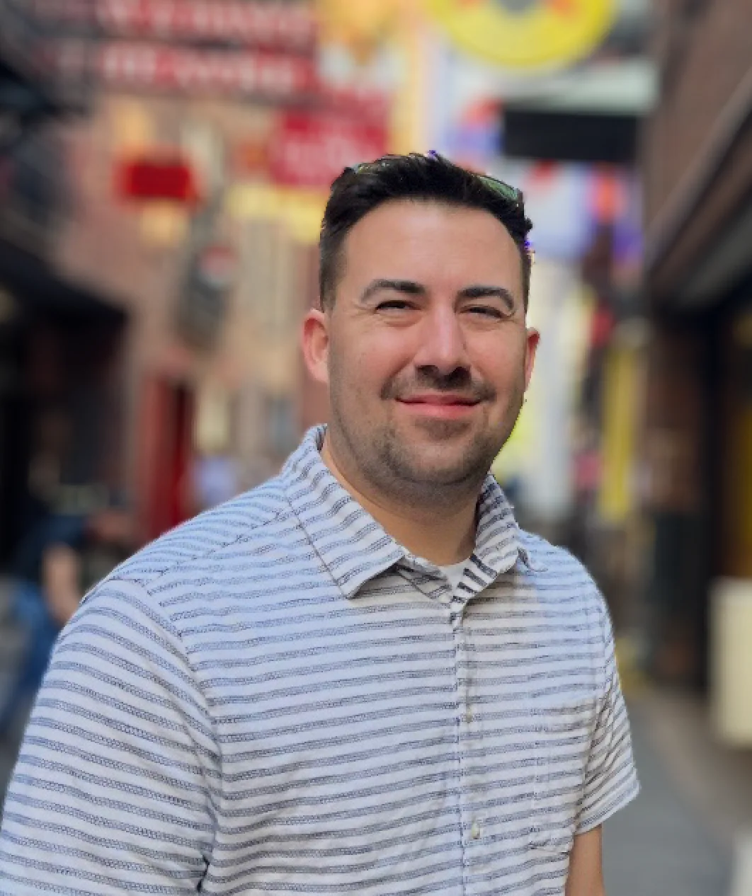 Josh Travitz smiling in a portrait