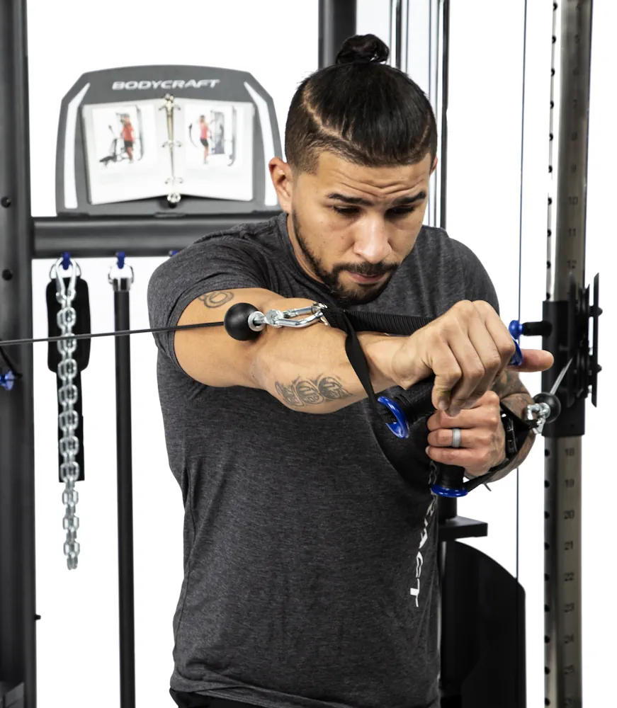 Man working out using Bodycraft equipment