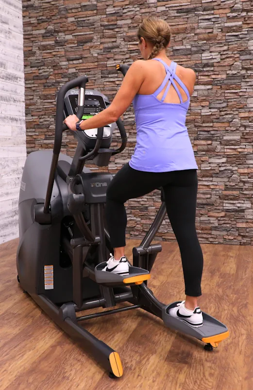 Woman using Octane step machine