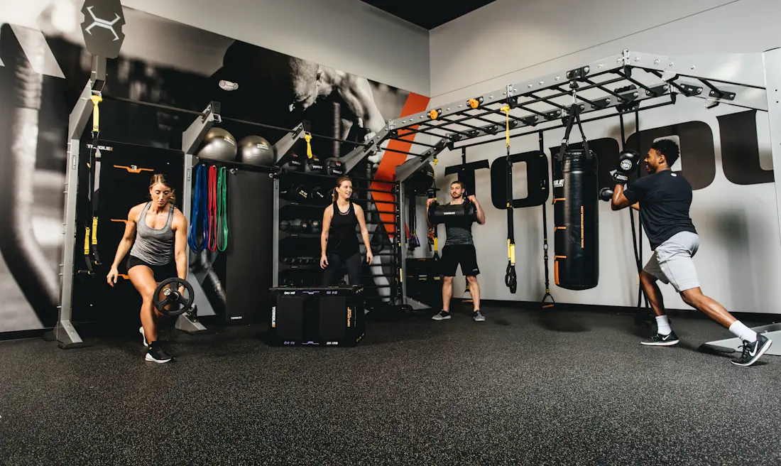 Group in gym using Torque equipment